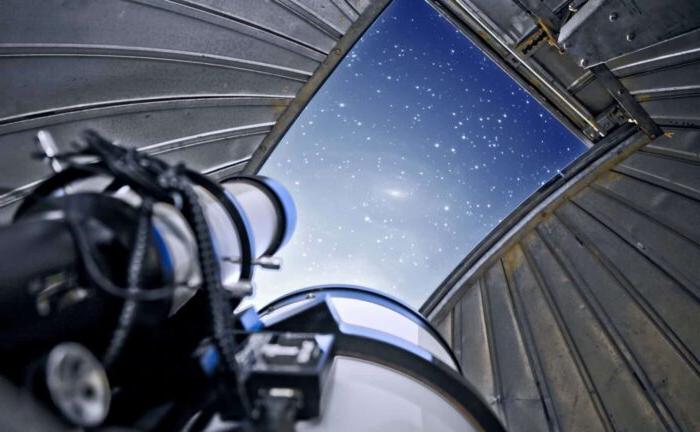 Image of telescope and stars.